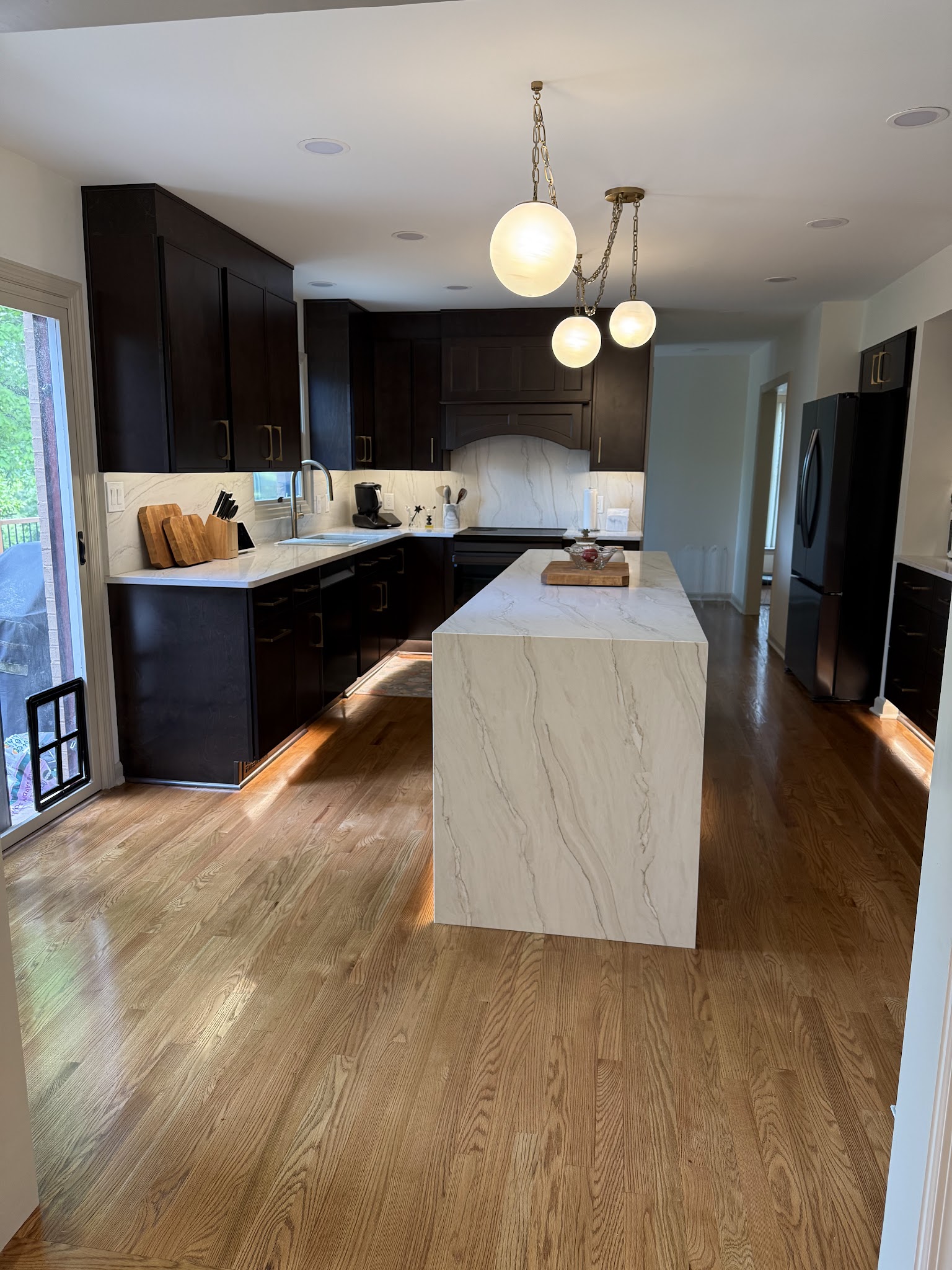 A finished Pittsburgh Property Remodelers kitchen with a waterfall island